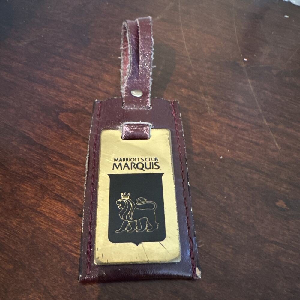 Marriott's Club Marquis luggage tag, leather and brass, hidden ID under flap